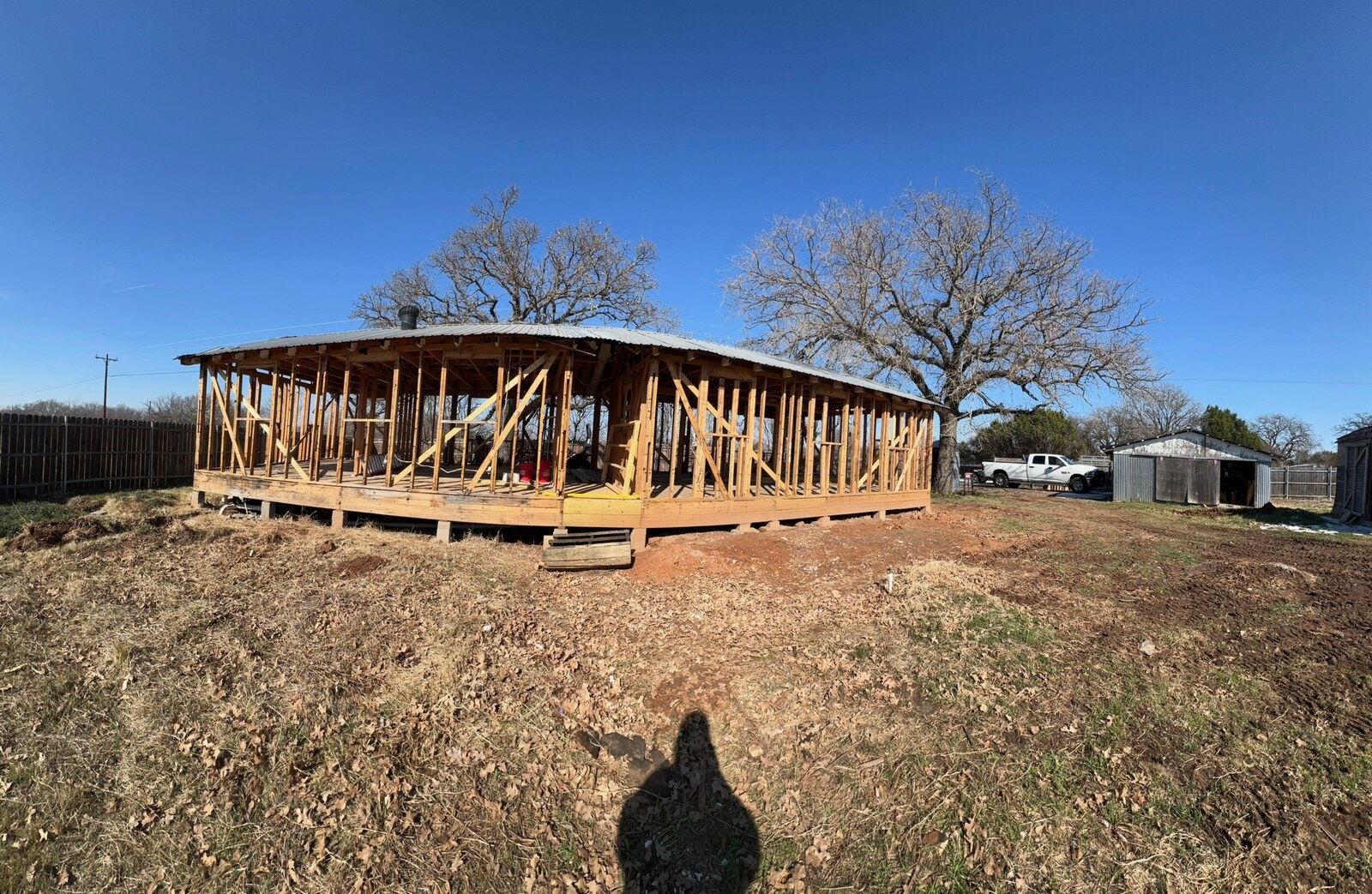 Wide yard and mature trees on the Lipan property